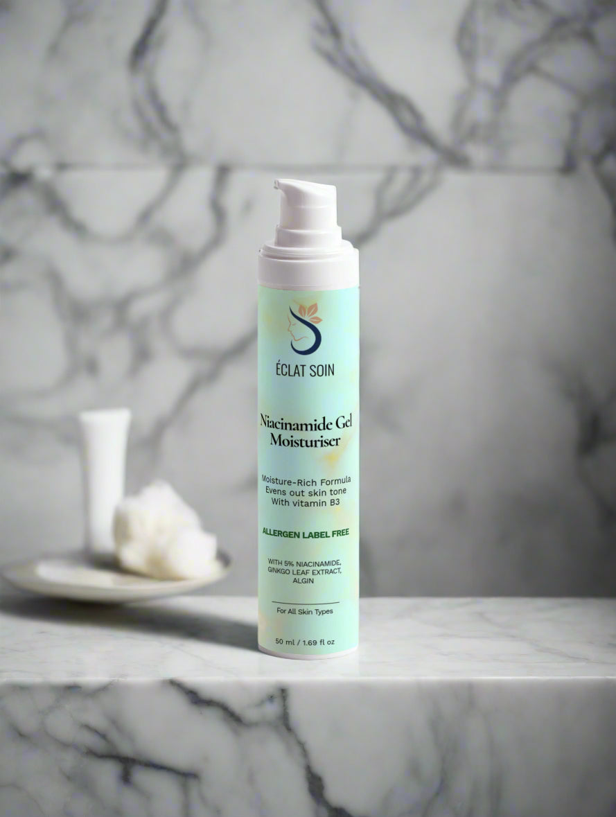 Eclat Soin Niacinamide Gel Face Moisturiser in a pump bottle on a marble surface